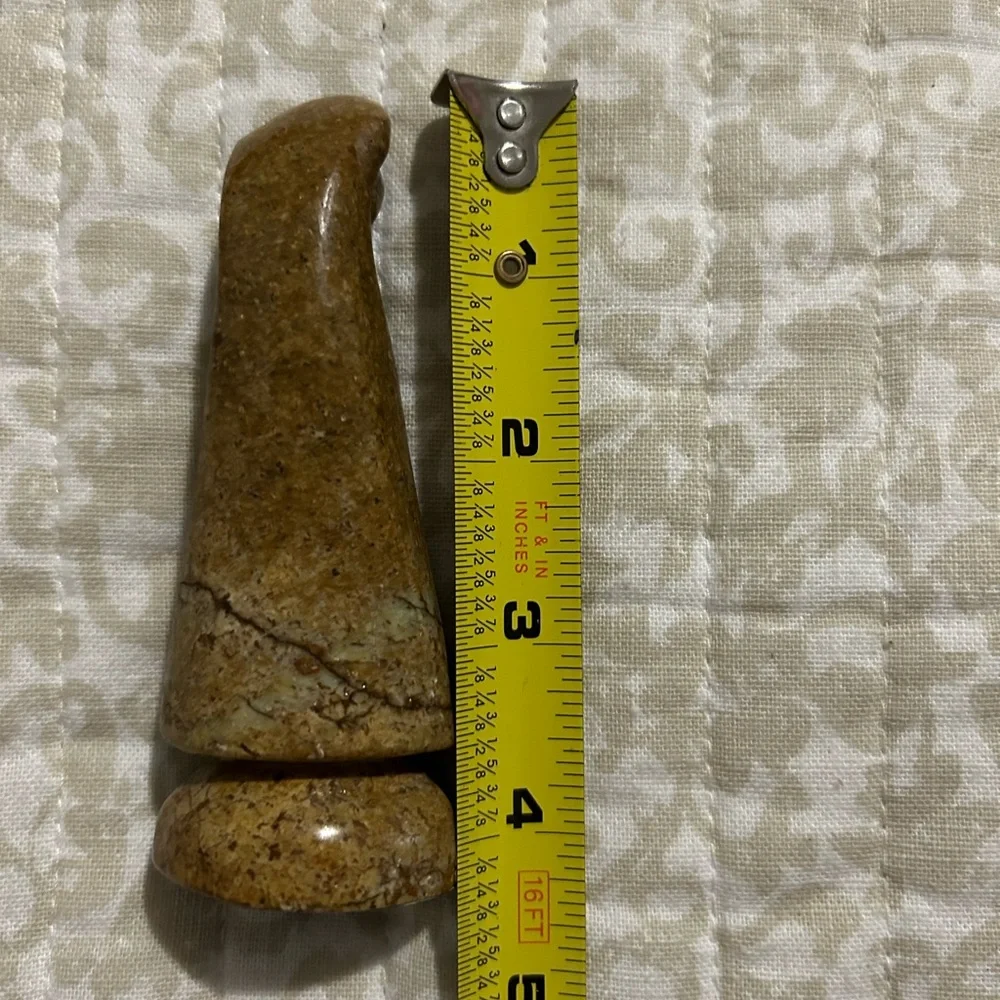 Carved stone figurine, praying Virgin Mary.